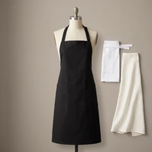 Restaurant aprons: black chef bib apron, white waist apron and ivory bistro apron by International Linens