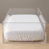 Crib sheets: white knitted fitted crib sheet on a hospital bassinet mattress by International Linens