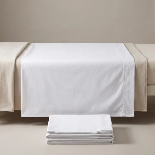 Hospital draw sheets: white woven draw sheet across a hospital bed by International Linens
