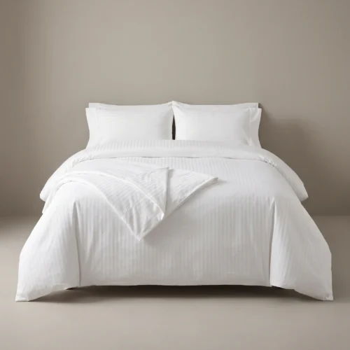Hotel duvet covers: white satin-stripe duvet cover on a king hotel bed by International Linens