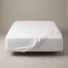 Hotel fitted sheets: white deep-pocket fitted sheet on a hotel mattress by International Linens