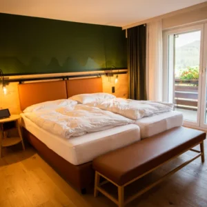 Hotel bed with white bedding