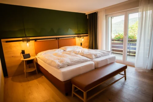 Hotel bed with white bedding