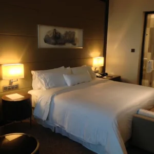 Hotel bed with white duvet