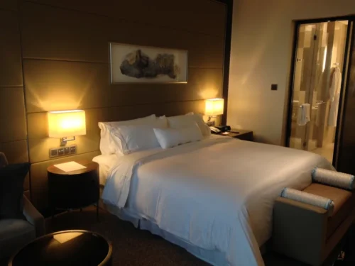 Hotel bed with white duvet
