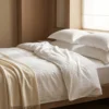 Sateen hotel sheets in use: white sateen and satin-stripe hotel bed linen by International Linens