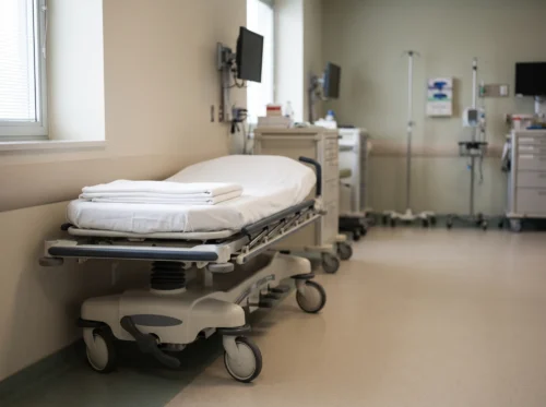 Stretcher sheets in use: white fitted sheet on a hospital gurney by International Linens
